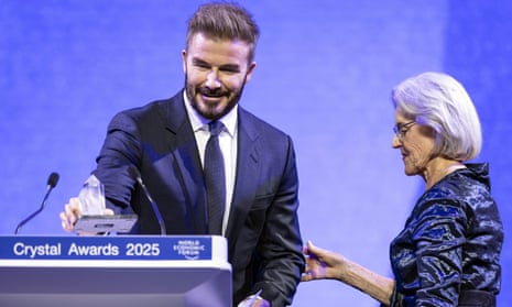 David Beckham prepares to speak after receives a Crystal Award from Hilde Schwab, Chairperson and Co-Founder, Schwab Foundation for Social Entrepreneurship.