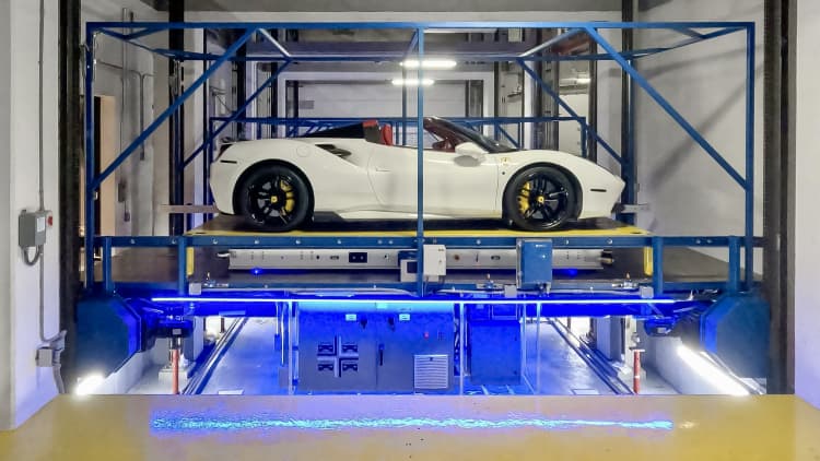 How robots lift, spin and precisely park a Ferrari