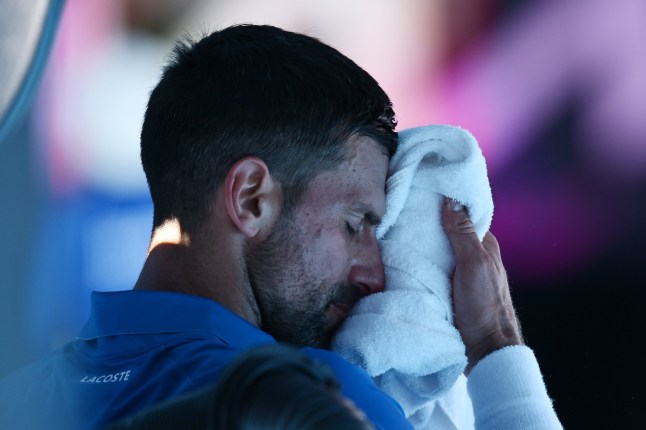 MELBOURNE, AUSTRALIA - JANUARY 24: Novak Djokovic of Serbia reacts in the Men's Singles Semifinal against Alexander Zverev of Germany during day 13 of the 2025 Australian Open at Melbourne Park on January 24, 2025 in Melbourne, Australia. (Photo by Hannah Peters/Getty Images)