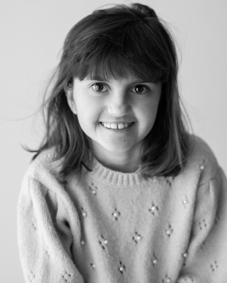 Black and white portrait of Elena, an 18-year-old who died from a rare genetic disorder.