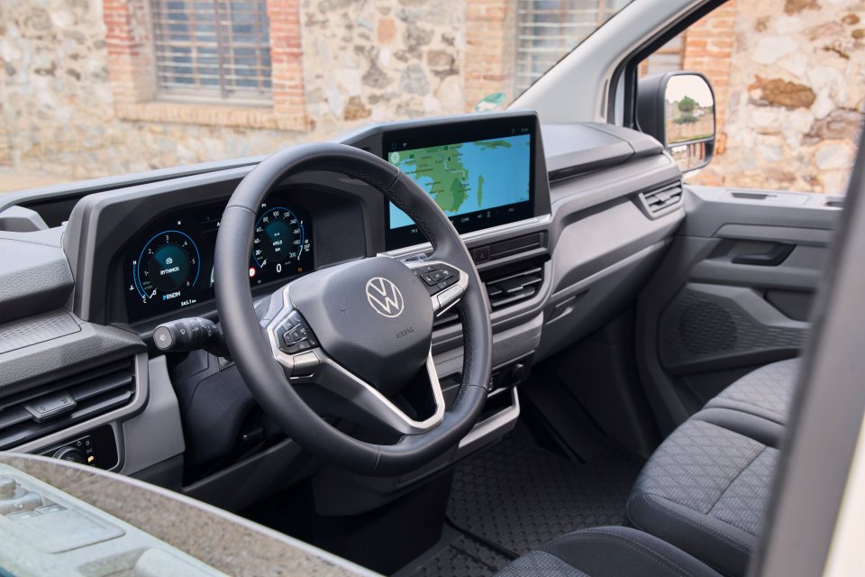 Volkswagen van interior with navigation system displayed.