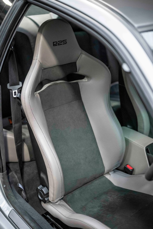 Close-up of a gray and black Subaru Prodrive P25 car seat.