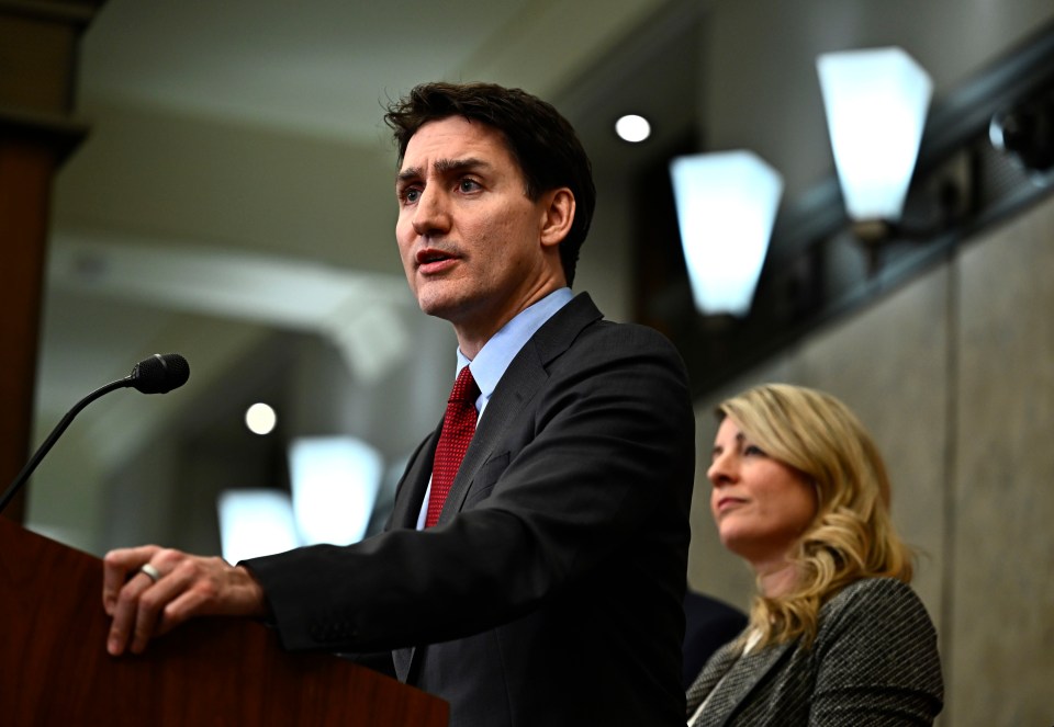 Justin Trudeau speaking at a podium.