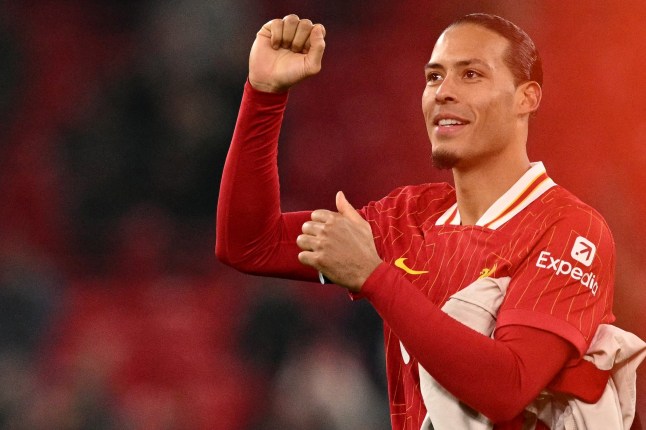 Liverpool's Dutch defender #04 Virgil van Dijk reacts following the English League Cup semi-final second leg football match between Liverpool and Tottenham Hotspur at Anfield in Liverpool, north west England on February 6, 2025. (Photo by Oli SCARFF / AFP) / RESTRICTED TO EDITORIAL USE. No use with unauthorized audio, video, data, fixture lists, club/league logos or 'live' services. Online in-match use limited to 120 images. An additional 40 images may be used in extra time. No video emulation. Social media in-match use limited to 120 images. An additional 40 images may be used in extra time. No use in betting publications, games or single club/league/player publications. / (Photo by OLI SCARFF/AFP via Getty Images)