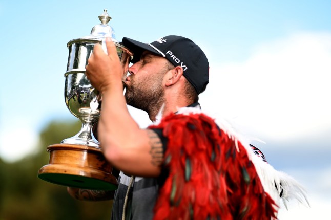 QUEENSTOWN, NEW ZEALAND - MARCH 02: Ryan Peake of Australia celebrates with the New Zealand Open trophy after winning the 2025 New Zealand Open at Millbrook Resort on March 02, 2025 in Queenstown, New Zealand. (Photo by Hannah Peters/Getty Images)