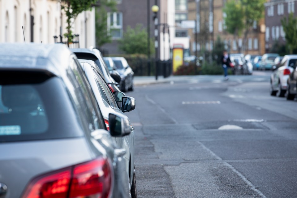 Cars parked on a city street.