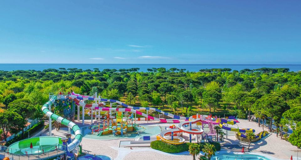 Aerial view of a water park near the ocean.