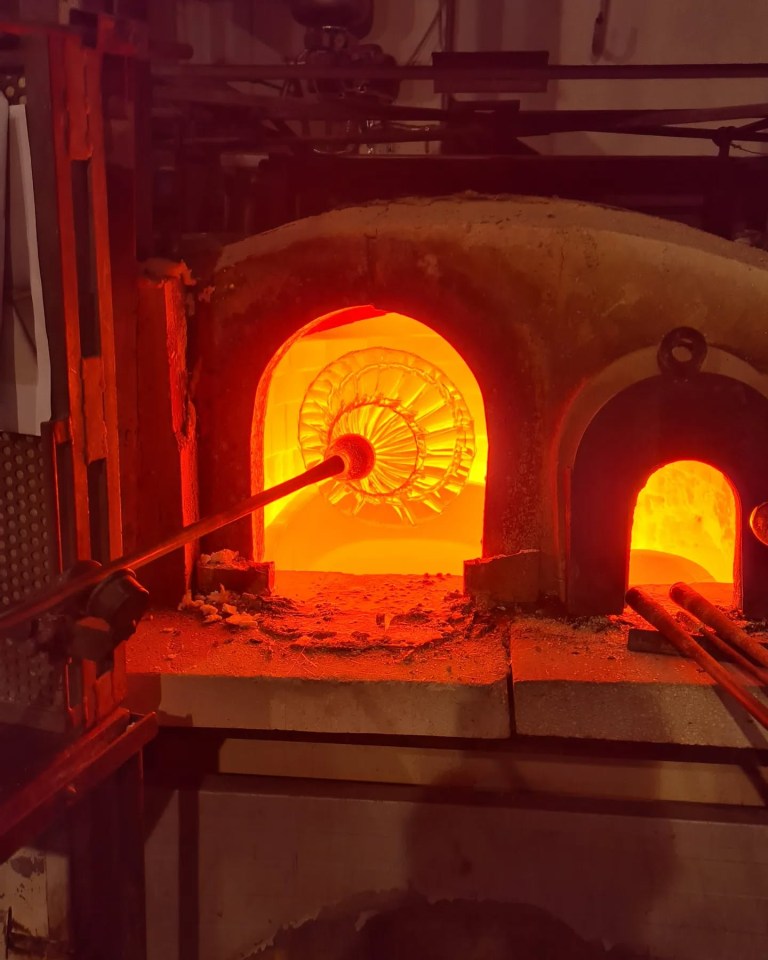 Murano glass being formed in a furnace.