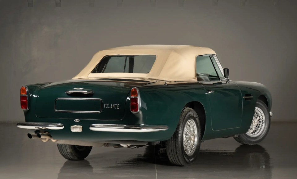 Rear view of a dark green Aston Martin DB Short-Chassis Volante convertible.