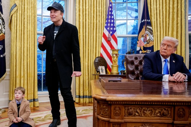 WASHINGTON, DC - FEBRUARY 11: Tesla and SpaceX CEO Elon Musk, accompanied by his son X Musk and U.S. President Donald Trump, jokingly reacts to a reporter's question during an executive order signing in the Oval Office at the White House on February 11, 2025 in Washington, DC. Trump is to sign an executive order implementing the Department of Government Efficiency's (DOGE) "workforce optimization initiative," which, according to Trump, will encourage agencies to limit hiring and reduce the size of the federal government. (Photo by Andrew Harnik/Getty Images)