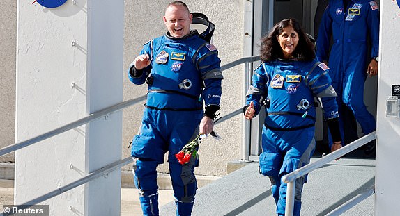 FILE PHOTO: NASA astronauts Butch Wilmore and Suni Williams walk at NASA's Kennedy Space Center, on the day of Boeing's Starliner-1 Crew Flight Test (CFT) mission on a United Launch Alliance Atlas V rocket to the International Space Station, in Cape Canaveral, Florida, U.S., June 1, 2024. REUTERS/Joe Skipper/File Photo