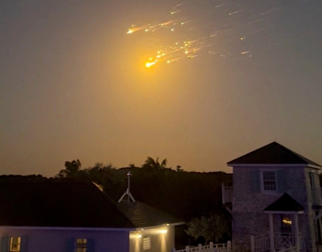 A view shows debris streaking through the sky, after SpaceX's Starship spacecraft tumbled and exploded in space, in Big Sampson Kay, Bahamas, March 6, 2025, in this screen grab obtained from social media video. @_ericloosen_/via REUTERS THIS IMAGE HAS BEEN SUPPLIED BY A THIRD PARTY. MANDATORY CREDIT. NO RESALES. NO ARCHIVES. THIS IMAGE WAS PROCESSED BY REUTERS TO ENHANCE QUALITY, AN UNPROCESSED VERSION HAS BEEN PROVIDED SEPARATELY.