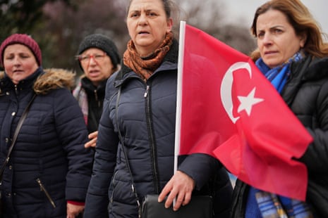 Women stand in protest outside the City Hall following the arrest of Istanbul Mayor Ekrem Imamoğlu today