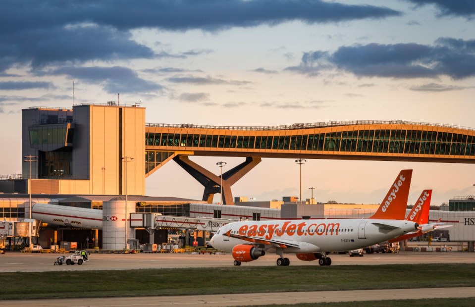 J15MF4 Easyjet plane waiting on the apron at Gatwick airport, near London, United Kingdom.