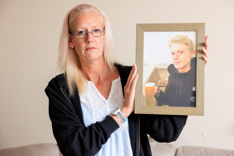 A grieving mother holds a framed photo of her deceased son, Britain's first fentanyl death.