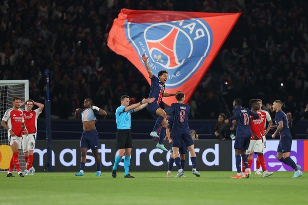 PARIS, FRANCE - MAY 07: Marquinhos of Paris Saint-Germain celebrates as Declan Rice of Arsenal looks dejected on the final whistle in the UEFA Champions League 2024/25 Semi Final Second Leg match between Paris Saint-Germain and Arsenal FC at Parc des Princes on May 07, 2025 in Paris, France. (Photo by James Gill - Danehouse/Getty Images)