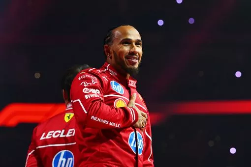 Lewis Hamilton reacts to cheering from fans at the F1 75 Live event at the O2 Arena in London