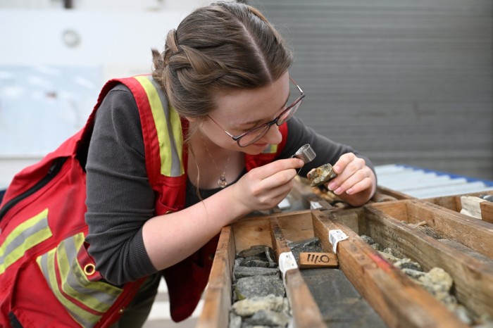 Lisa O’Brien, exploration geologist examines samples at the group’s offices in Omagh