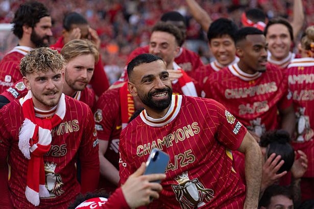 Liverpool's Mohamed Salah and the players celebrate winning the league after the Premier League match between Liverpool and Tottenham Hotspur at Anfield in Liverpool, England, on April 27, 2025.