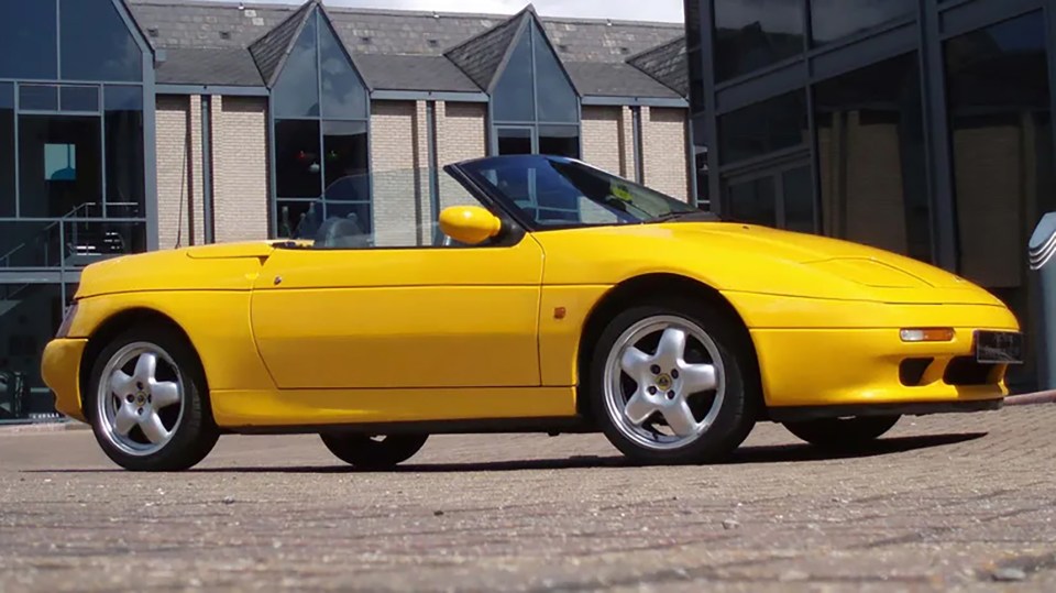 Yellow Lotus Elan SE Turbo convertible.