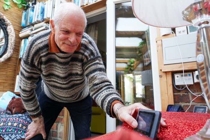 Walt Scales looks at his smart meter