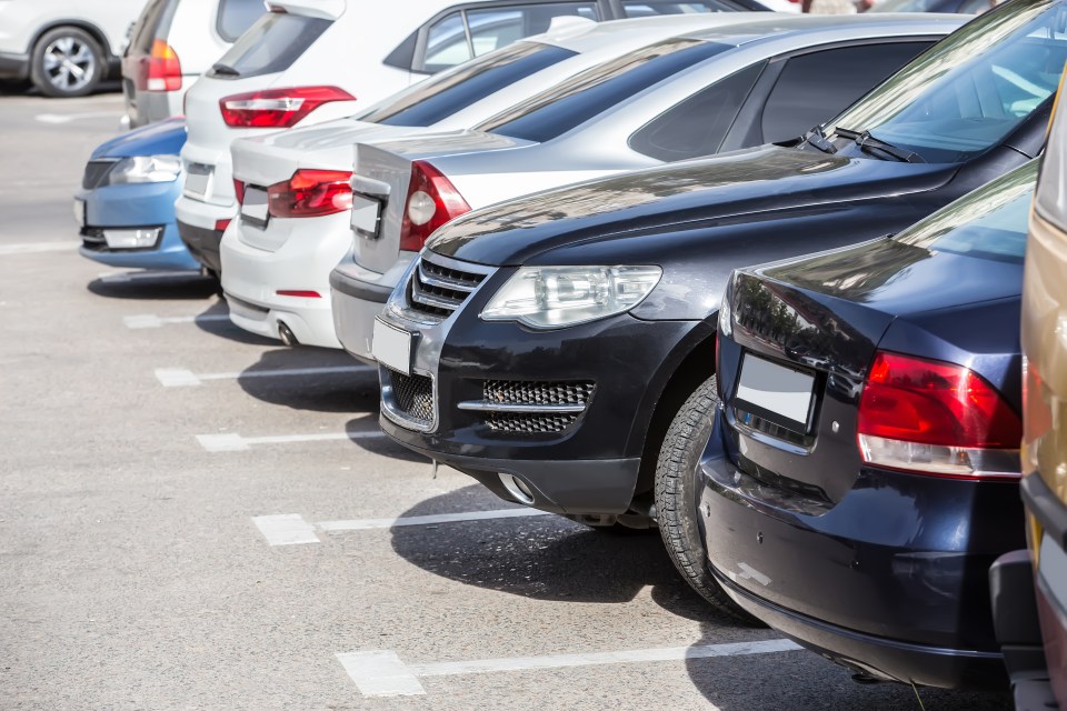 Cars parked in a parking lot.