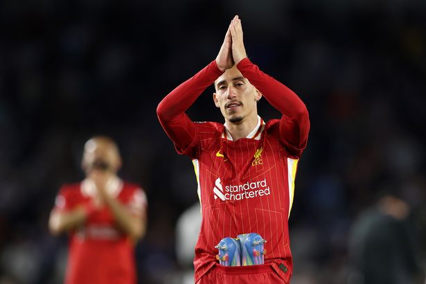 Kostas Tsimikas applauds after Brighton vs Liverpool